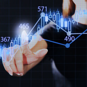 Finger pointing at an upward graph showing growth results of digital advertising