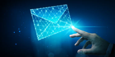 a finger touching a glowing digital envelope, symbolizing effective email marketing