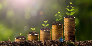 a stack of coins with plants growing on them, representing growth of U.S. associations